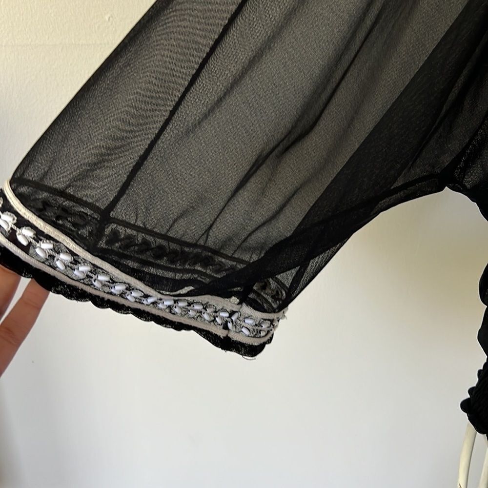 Beautiful pattern on black shirt with see thru sleeves - Picture 2 of 3